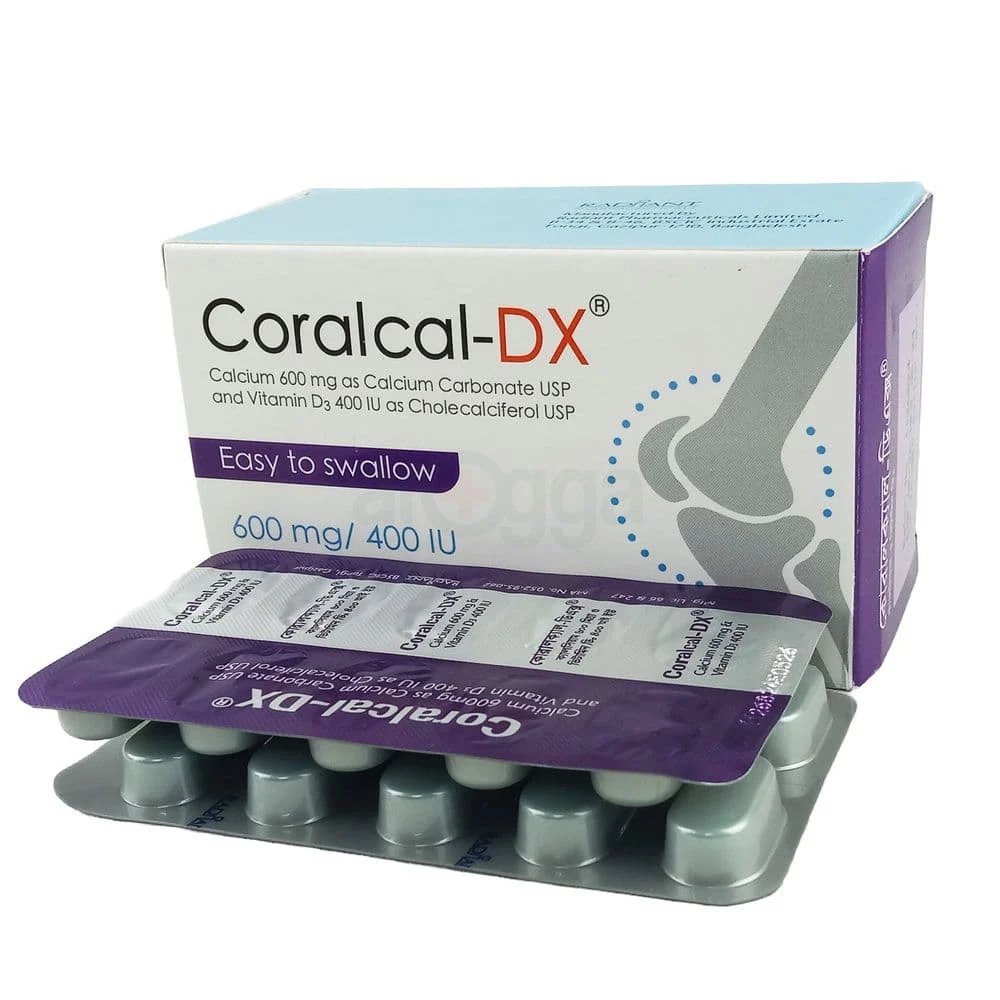 A close-up, angled view of a white and purple Coralcal-DX commercial carton by Radiant Pharmaceuticals, positioned behind a metallic silver tablet blister pack showing its purple foil backing.