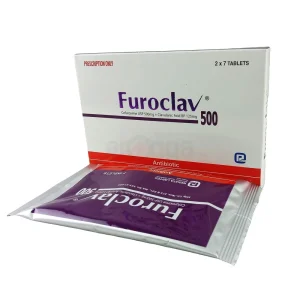 A close-up view of a standing white Furoclav 500 product box with an orange "Antibiotic" stripe, positioned behind a purple and silver protective foil packet containing medicine tablets.