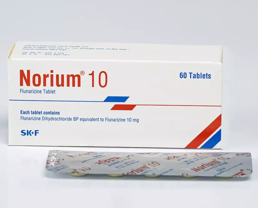 A front-facing view of a white commercial box of Norium 10 tablets by SK+F, with a single silver foil blister pack lying flat in the foreground against a white background.