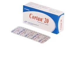 A white and blue cardboard box of Cortan 20 tablets sitting upright, with a single silver aluminum blister strip lying flat in front of it showing the printed brand name.