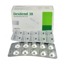 A front-facing view of a white Dexilend 30 packaging box with two overlapping silver blister packs placed directly in front of it.